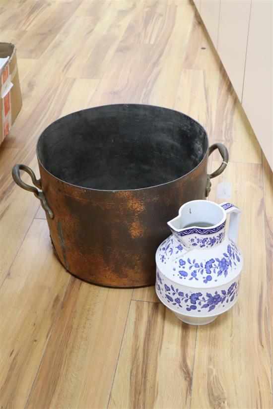 A large copper two handled preserve pot and a large modern blue and white pottery jug